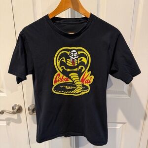 Black Graphic Tee with Yellow Cobra Logo
